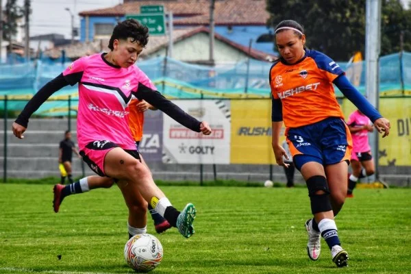 female soccer player dribbling